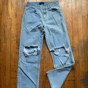 Cross distressed women's jeans